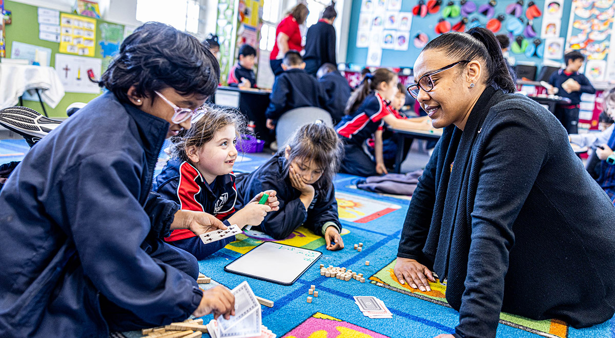Principal with students at St Oliver’s Catholic Primary School Harris Park