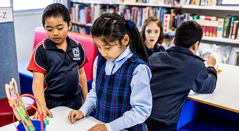 Students working in St Oliver’s Catholic Primary school library
