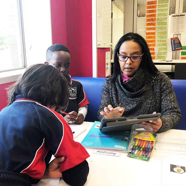 Principal with students at St Oliver’s Catholic Primary School Harris Park