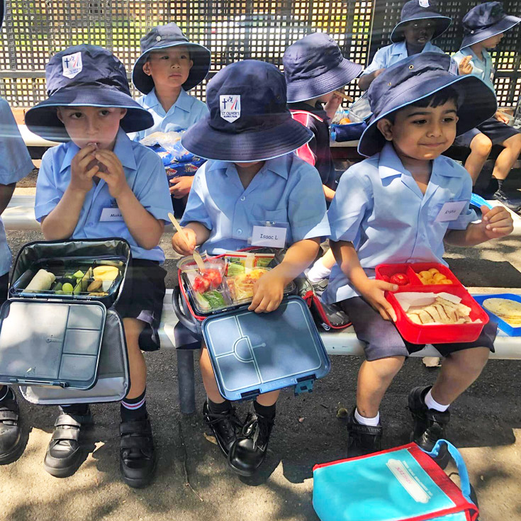 Kindergarten students eating lunch at St Oliver’s Catholic Primary School Harris Park