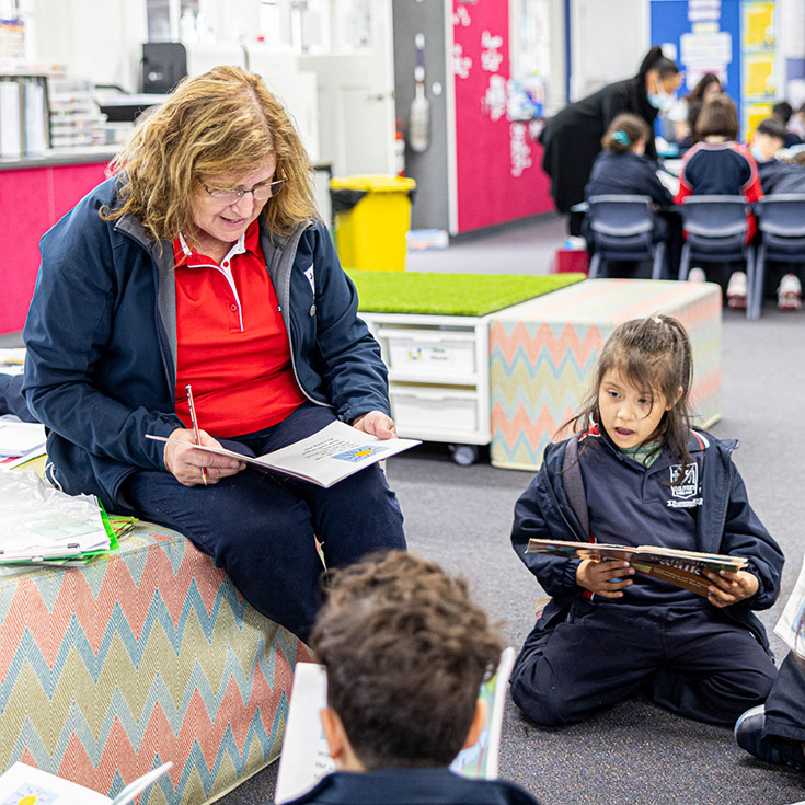 Teacher with students at St Oliver’s Catholic Primary School Harris Park